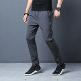 Hnzxzm Men Big Size Casual Quick Dry Sweatpants Spring Summer Thin Ice Silk Elastic Waist Street Male Slim Joggers Sports Trousers 5XL